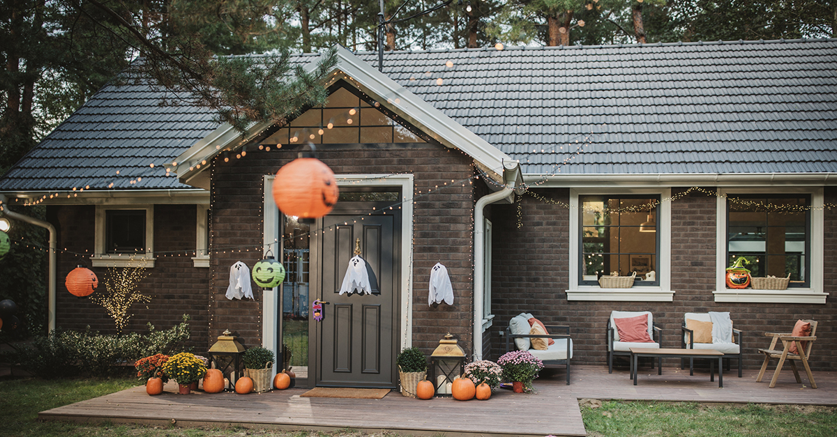 A brick home with Halloween decor